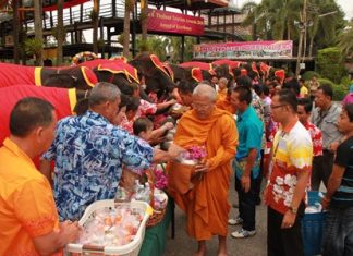 The tourist attraction’s Songkran Festival began early April 13 with 19 elephants giving alms and dried foods to nine monks from area temples.